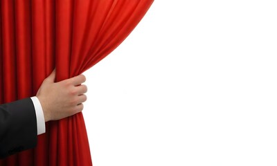 A hand pulling open a red curtain, revealing a white background