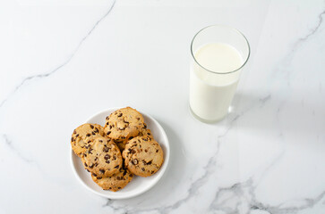 International Cookie Day. World Diabetes Day. National Real Sugar Day. World Heart Day. Breakfast with cookies and milk on the table