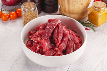 Raw beef meat - sliced strips