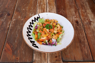 A plate of food with a white plate and a brown rim