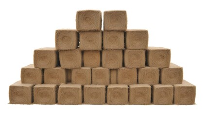Fototapeta premium Stacks of rectangular hay bales in a field