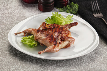 Grilled quail in the plate