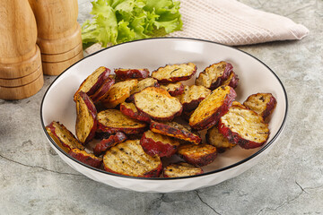 Baked red batat slices with herbs