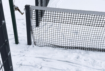 winter padel tennis court full of snow