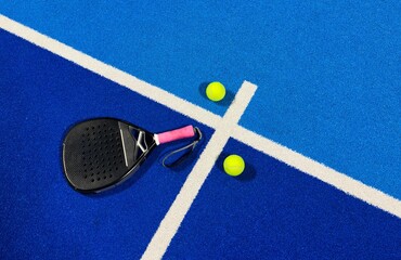 Paddle racket with a ball. Padel court 