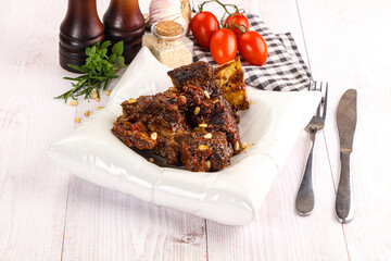 Prepared tasty beef ribs with sauce