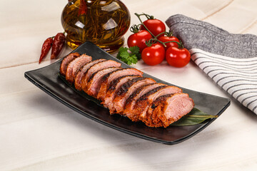 Sliced duck breast baked with cherry