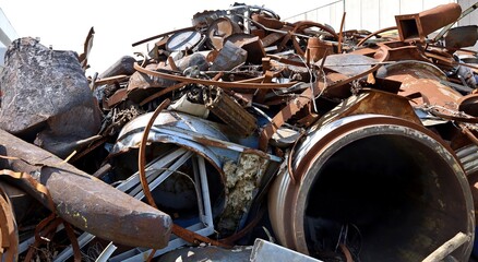 Heap of steel, iron and cast iron scrap in the metal recycling plant.
