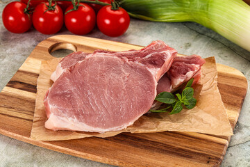 Raw pork steak loin with bone