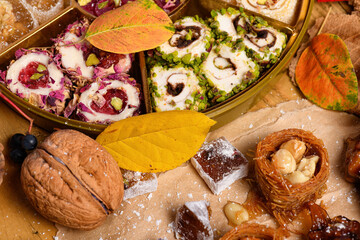 Sweet food Turkish delight on wooden background, assorted locum and candy as decorated backdrop
