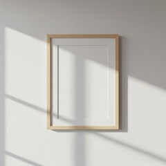 Minimalist Elegance: Blank Frame on a Sunlit Wall