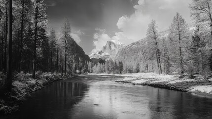 Yosemite's Merced River flows with Half Dome rising in the distance.