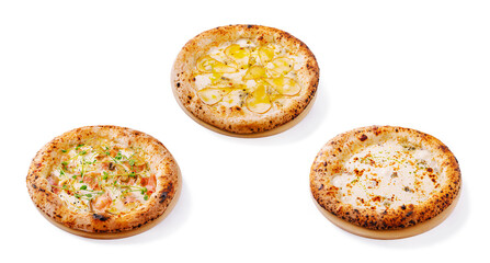 Three different styles of artisanal flatbreads on a clean surface
