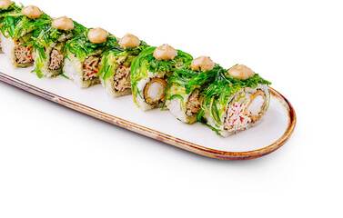 Sushi rolls elegantly presented on a long white plate
