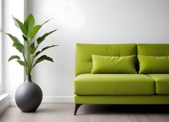 A modern sofa in a minimalist living room setting, with a vase of green plants and a wall in the background