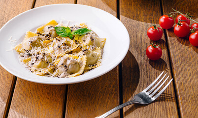 Gourmet italian ravioli on rustic wooden table
