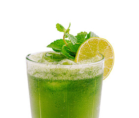 Refreshing green drink with mint and lime served in a glass