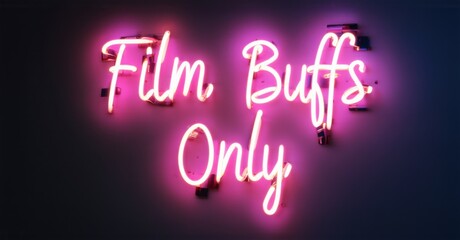 Bright pink neon sign displaying Film Buffs Only against a dark background, creating an exclusive cinematic atmosphere for movie lovers, critics, and passionate film enthusiasts