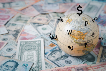 World on international banknotes with currency sign include dollar euro yen yuan pound sterling for...