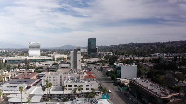 Rising and panning aerial shot of Ventura Blvd. looking east towards Interstate 405 in Encino, California. 4K