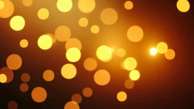 Golden bokeh lights gently evolving in a warm and luminous abstract background