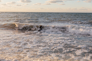 Men surfing the waves summer