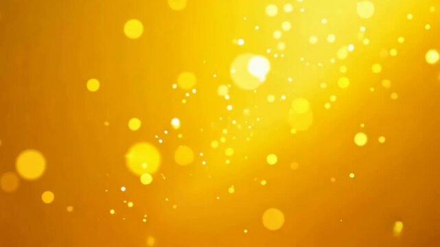 Golden bokeh light movement: abstract glittering particles in warm yellow background