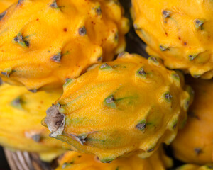 Closeup of fresh ripe Yellow Dragon Fruits (Pitaya Amarela) fruits on a market stall in Madeira