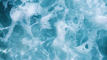 Obraz premium Transparent blue clear water surface texture with ripples, splashes and bubbles. Abstract summer banner background Water waves in sunlight with copy space Cosmetic moisturizer micellar toner emulsion