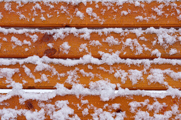 wooden background in the snow
