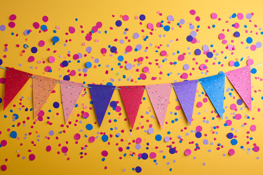 Colorful Triangular Bunting Flags on Yellow Polka Dot Background - Powered by Adobe