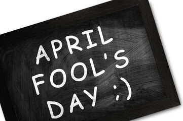 Chalkboard with text April Fool's Day on wite background. 1st April celebration