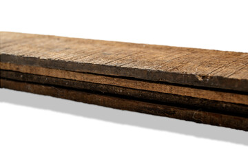 Closeup view of wood plank stack isolated over white background. Natural wooden texture
