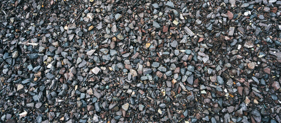 Granite rubble for the background. Building materials, crushed rock. Panoramic background