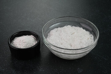 Mixing baking soda with vinegar.