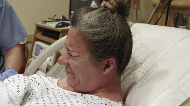 Women In Labor in the Labor and Delivery Room at the Hospital
