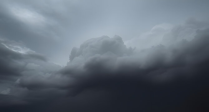 Dark storm clouds rolling in background. Heavy gray formations gathering ominously