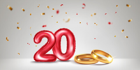 A red number 20 in the form of a balloons with two gold wedding rings, symbolizing the celebration of the twentieth wedding anniversary, surrounded by colorful confetti, on light background.