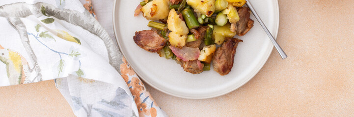Stewed duck fillet with potatoes and asparagus and radishes, mixed salad of various greens, healthy delicious breakfasts or lunches, banner