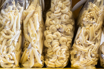Italian pasta di Gragnano displayed in plastic bags in a store