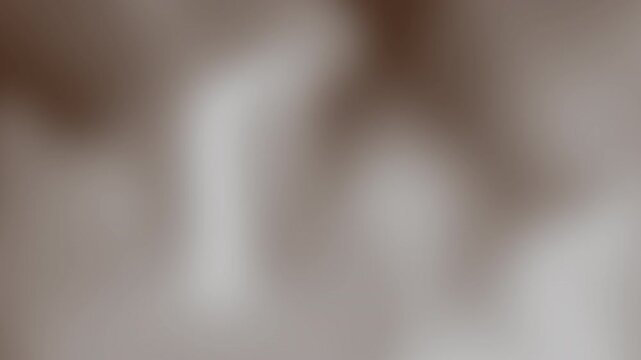 Abstract soft blurred background with gentle gradients and subtle textures in neutral tones, Brown coffee cream beige pastel color gradient seamless motion background