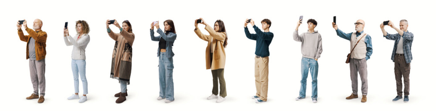 Large group of ordinary people taking photos with smartphones