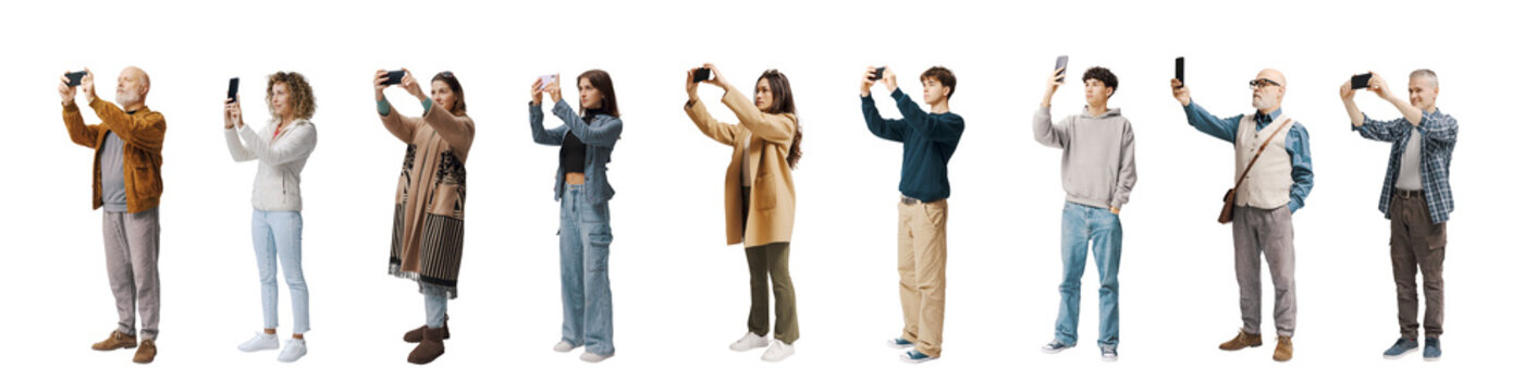 Large group of ordinary people taking photos with smartphones