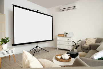Interior of light room with projector screen and armchairs