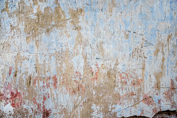 Old destroyed plaster wall of an abandoned temple as a background.