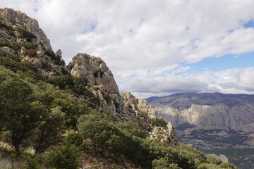 Naklejka premium The mountain panorama opening from the hiking path to pick Puig Campana, Finestrat, Benidorm, Spain