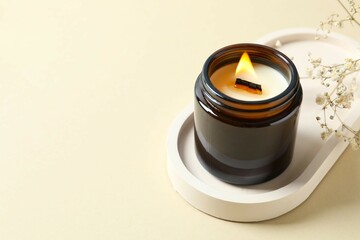 Handmade scented candle in a glass. Soy wax candle with a wooden wick