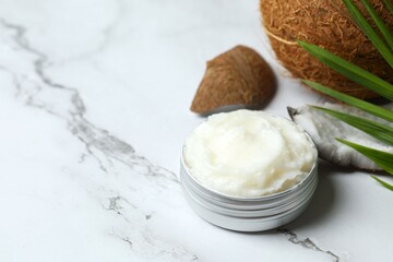 Jar of coconut oil on table