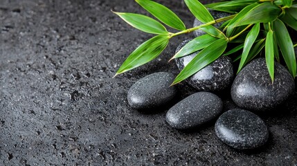 Relaxing Spa Stones with Bamboo Leaves on Wet Black Surface