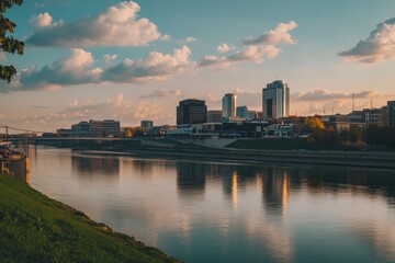 Fototapeta premium Riverbank scenery with city skyline in the background